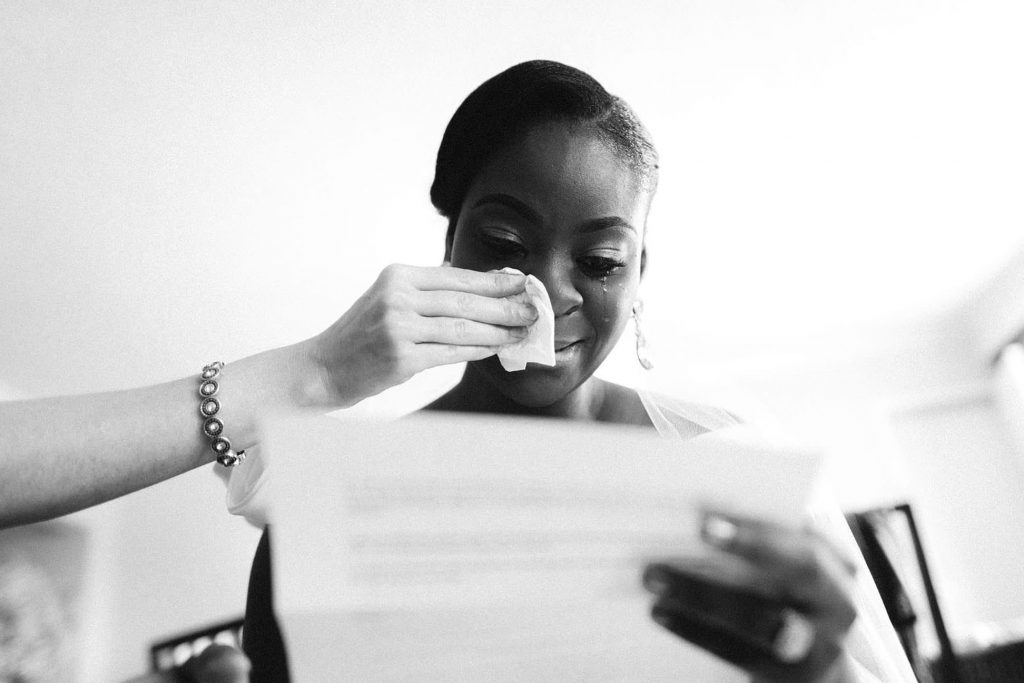 North Carolina wedding photographer capturing bride reading love letter